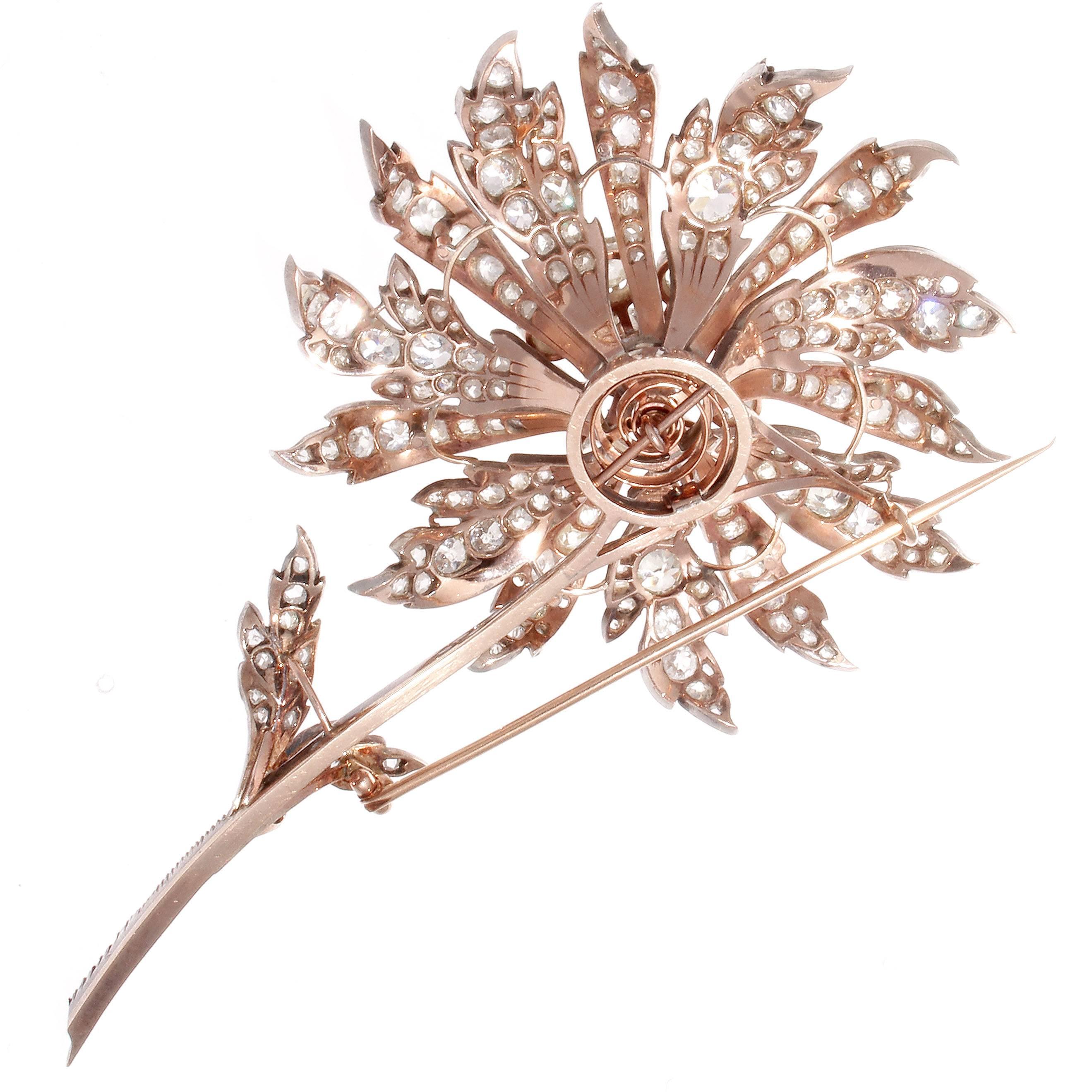 Created with approximately 23 carats of old miner diamonds, all original to the piece. The entremble is stunning and extremely well made. The pin is made to be unscrewed and the flower may be worn as a pendant. A truly outstanding and spectacular