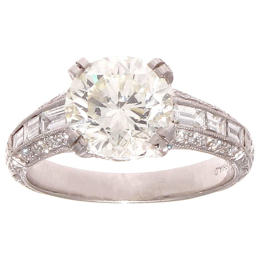 The classic engagement ring refined with a creative symmetrical touch. Sophia D intertwines modern techniques but stays true to their inspiration which comes from the timeless designs of the art deco time period. Featuring a 2.40 carat round
