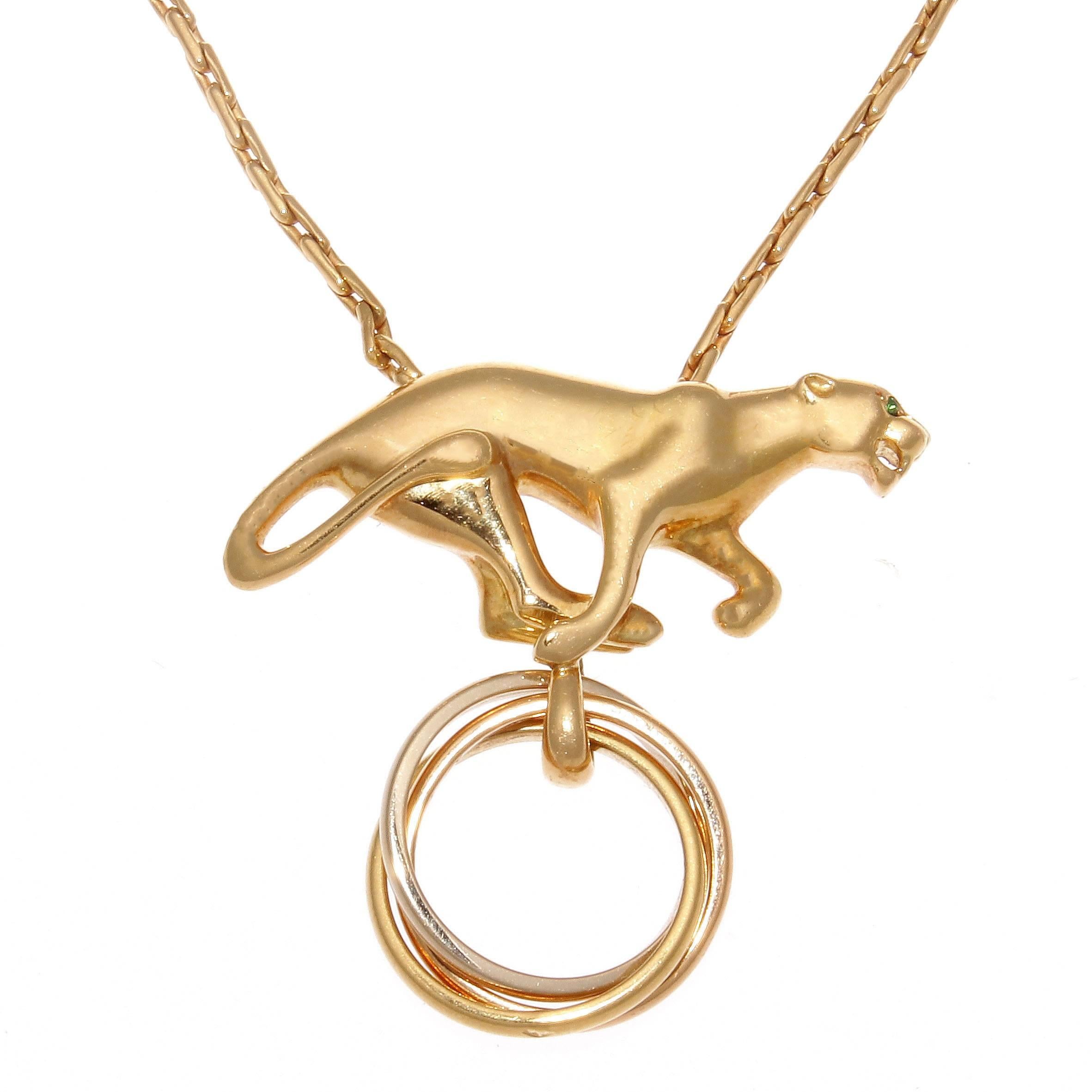 Infusing two of its most recognizable designs Cartier has created an alluring piece of jewelry. This exquisite hybrid combines the trinity collection with a new version of the panther, the ideal representation of the jewelry house's mastery. Signed