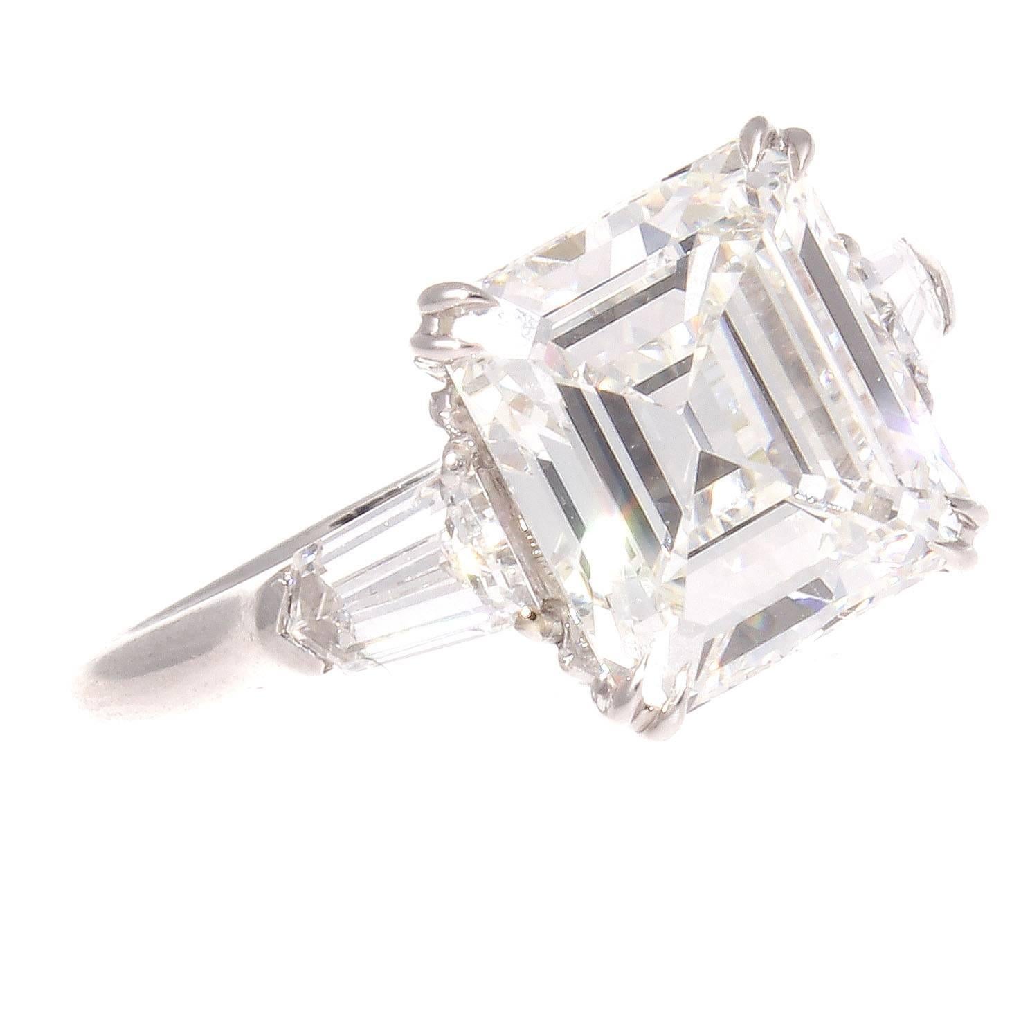 From the golden era of jewelry. This elegant ring features a 4.12 carat emerald cut diamond that is GIA certified as H color and VVS2 clarity. With perfect proportions the stone illuminates with brilliance creating a sparkle and charm that demands