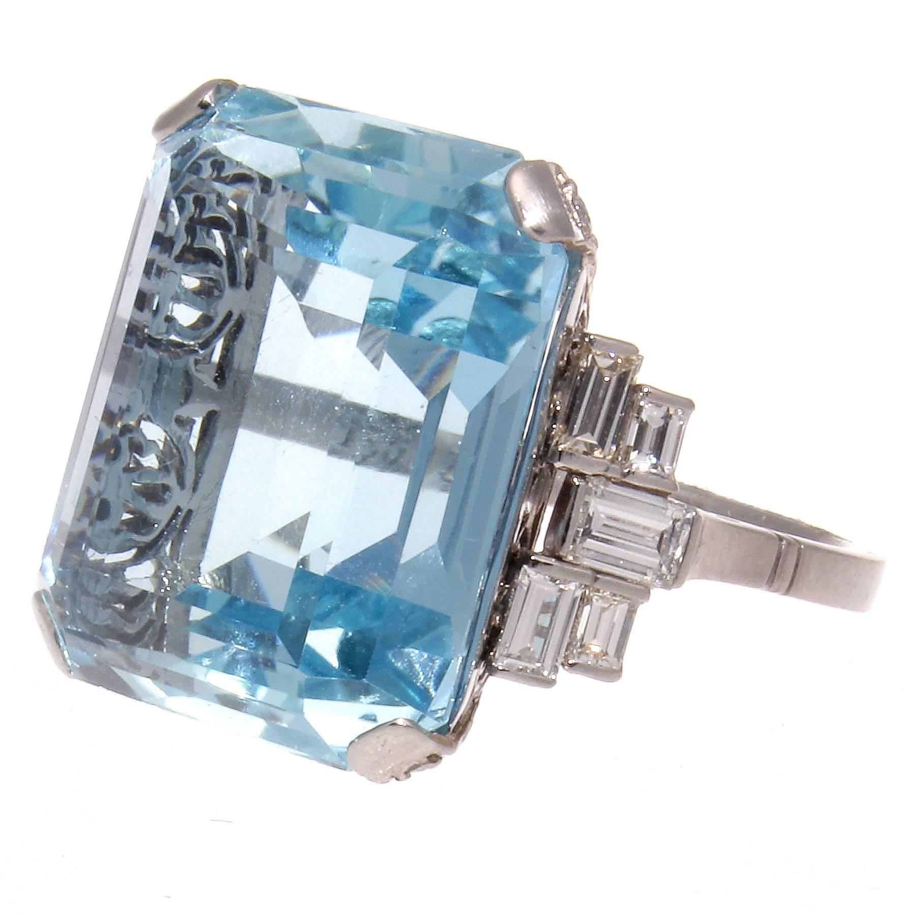 A serene amount of color that is combined with a factor of symmetry and beauty. Featuring a 20.50 carat aquamarine that is accented on either side by colorless diamonds. Crafted in platinum.
 
Ring size 7 and may easily be resized complimentary with