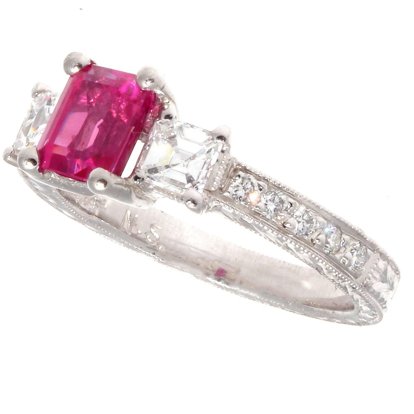 Subject to a color that is hardly ever replicated. Featuring a vibrant pink sapphire that weighs 1.20 carats accented by colorless diamonds. Crafted in platinum.
