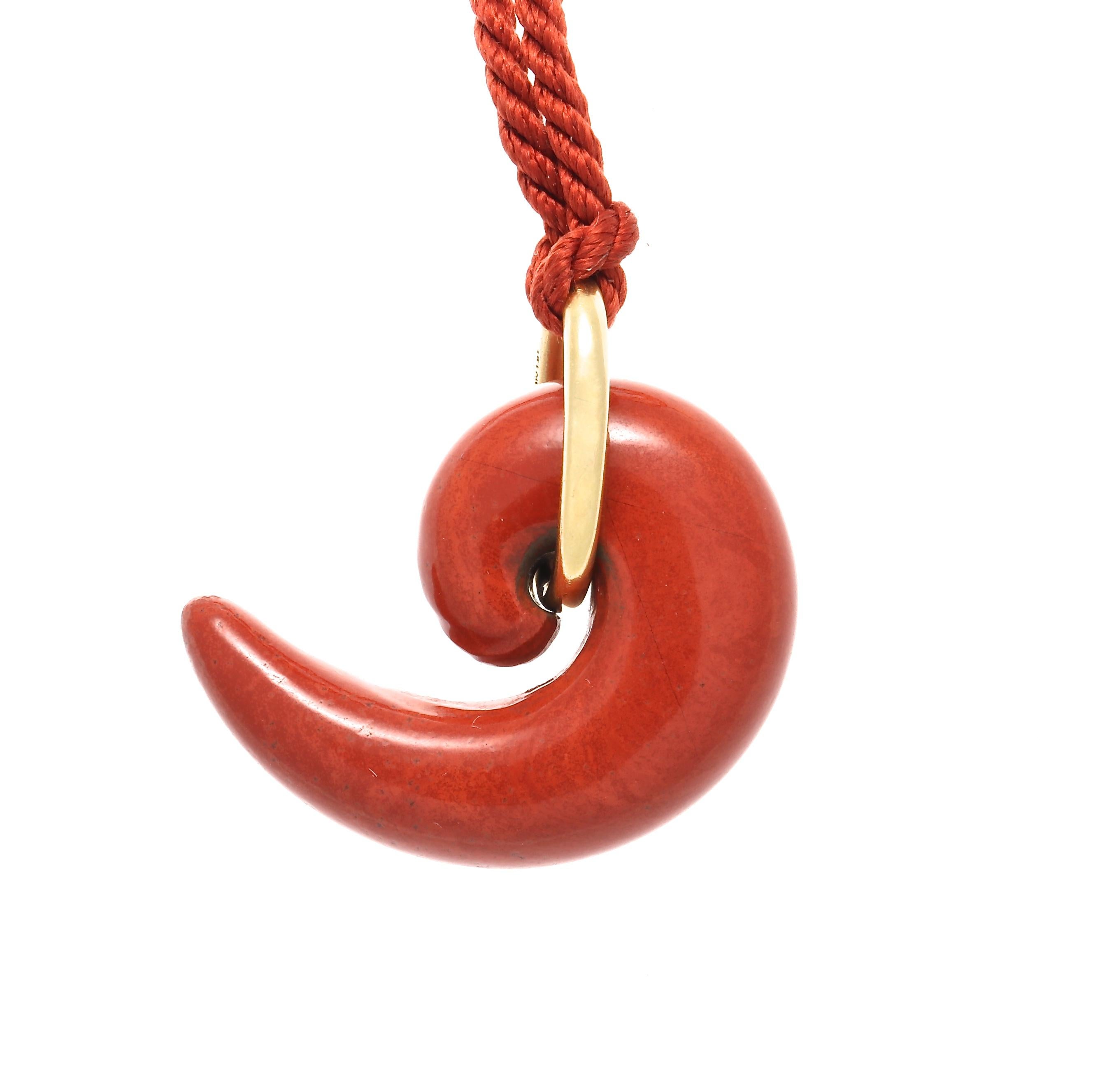 A stone of physical strength and energy, red Jasper is said to increases one's life force, health and passion, bringing the courage to face unpleasant tasks and to rectify unjust situations. Designed with a swooping multicolored red Jasper hanging