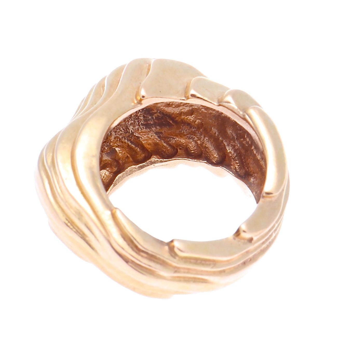 A couples vision built upon the principles of quality, creativity, and individuality to create their eponymous label. Featuring rolling contours of  18k rose gold forming this unique modernist design. Ring size 6-1/4.