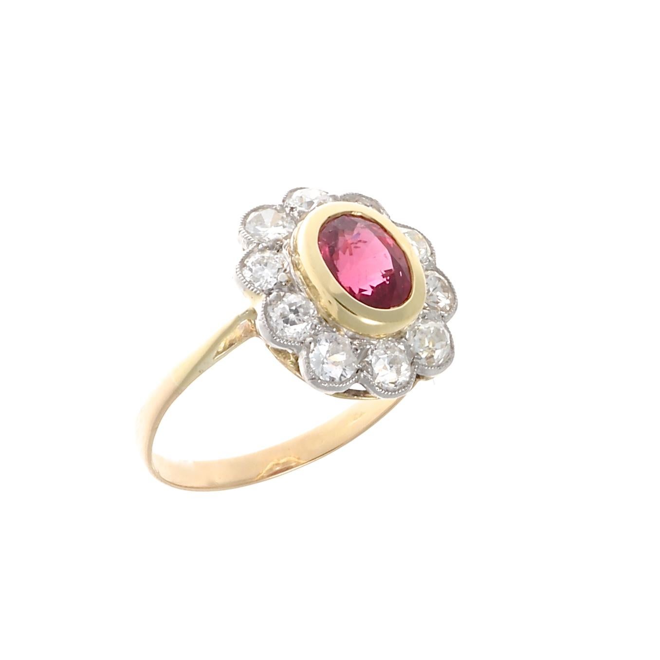 The iconic flower motif, a quintessential jewelry design capturing everything that’s beautiful about the natural world. Used for centuries in jewelry it has taken on many forms and colors. Featuring a lively red AGL certified Mozambique ruby that