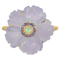 Chalzedon-Manschette mit Opal in der Mitte, Tansanit-Halo und Diamanten in 18K Gold