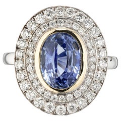 Zafiro azul de 3,53 ct con doble halo de diamantes en oro de 18 quilates