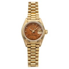 Rolex Lady Datejust 69178 vintage de 1988, en or jaune 18 carats, cadran couleur noyer, mouvement automatique, 26 mm