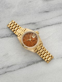 Rolex Lady Datejust 69178 vintage de 1988, en or jaune 18 carats, cadran couleur noyer, mouvement automatique, 26 mm