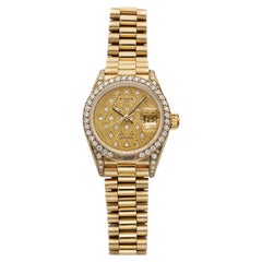 Rolex Lady Datejust 69158 vintage de 1988, en or jaune, cadran guilloché serti de diamants, mouvement automatique, 26 mm