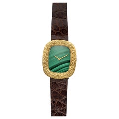 Movado Ellipse vintage des années 1970, en or jaune 18 carats, cadran en malachite, remontage manuel, 32 mm