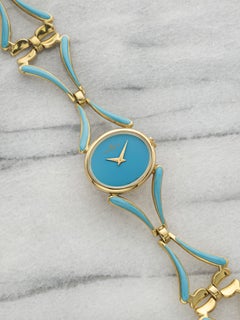 Reloj vintage Baume & Mercier 38244T2 de los años 60, de oro amarillo de 18 quilates, con esfera turquesa, cuerda manual, 24 mm
