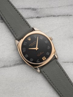Rolex Cellini de 2000, réf. 4233, en or rose bicolore, cadran noir à chiffres arabes, remontage manuel, 34 mm