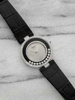 Años 2000: Chopard Happy Diamonds, oro blanco de 18 quilates, esfera cinética con diamantes, mecanismo de cuarzo, 33 mm