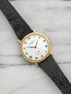 2000s Patek Philippe Calatrava 3919 18K Yellow Gold White Dial Manual 33mm