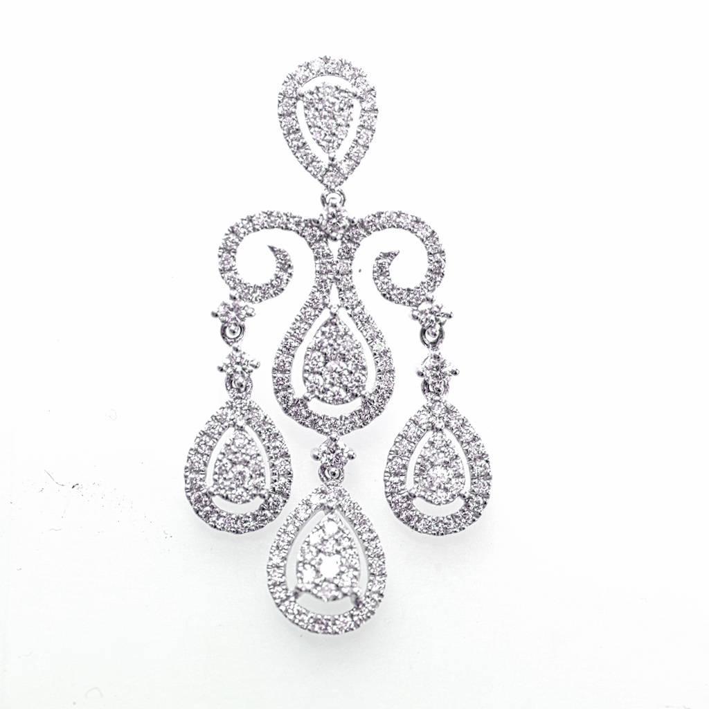 18k White Gold and Diamond Earrings

Stunning with lots of sparkle!
2.65 carats of round brilliant diamonds.
Posts with push back closure.
1.5 inches long.
