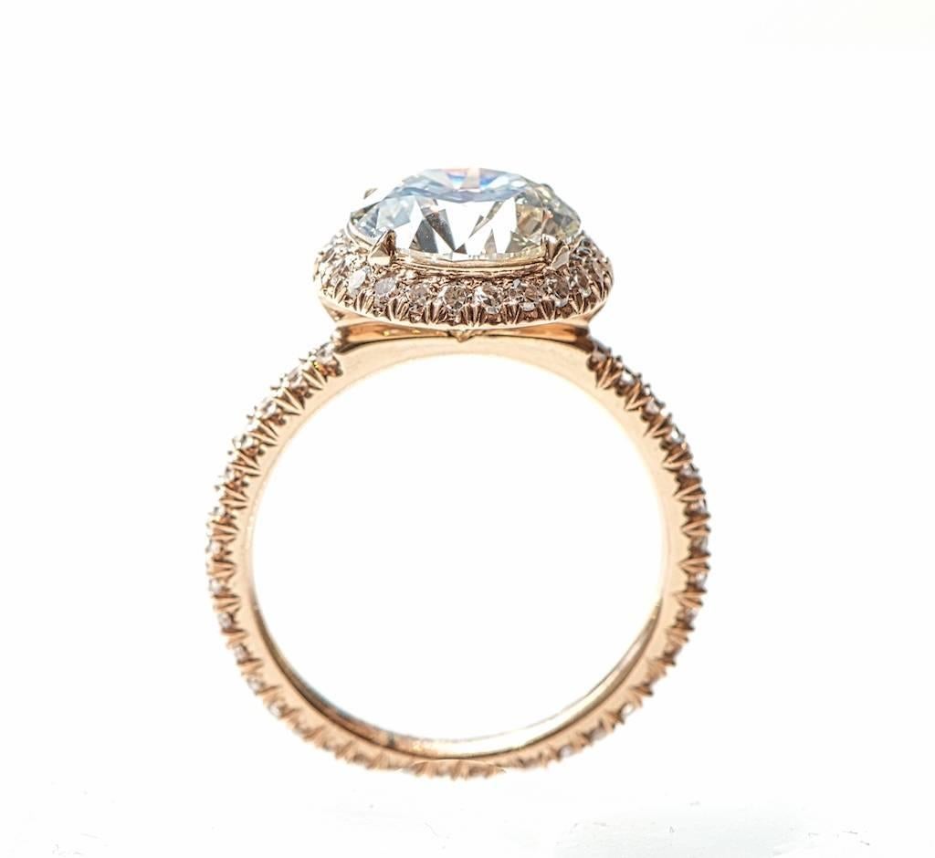Round brilliant halo engagement ring
2.51 carat round brilliant diamond, KVVS2.
0.58 carats of round brilliant diamonds in the setting.
18k Rose Gold

This exquisitely made ring features the finest workmanship.  Each micro-pave diamond was