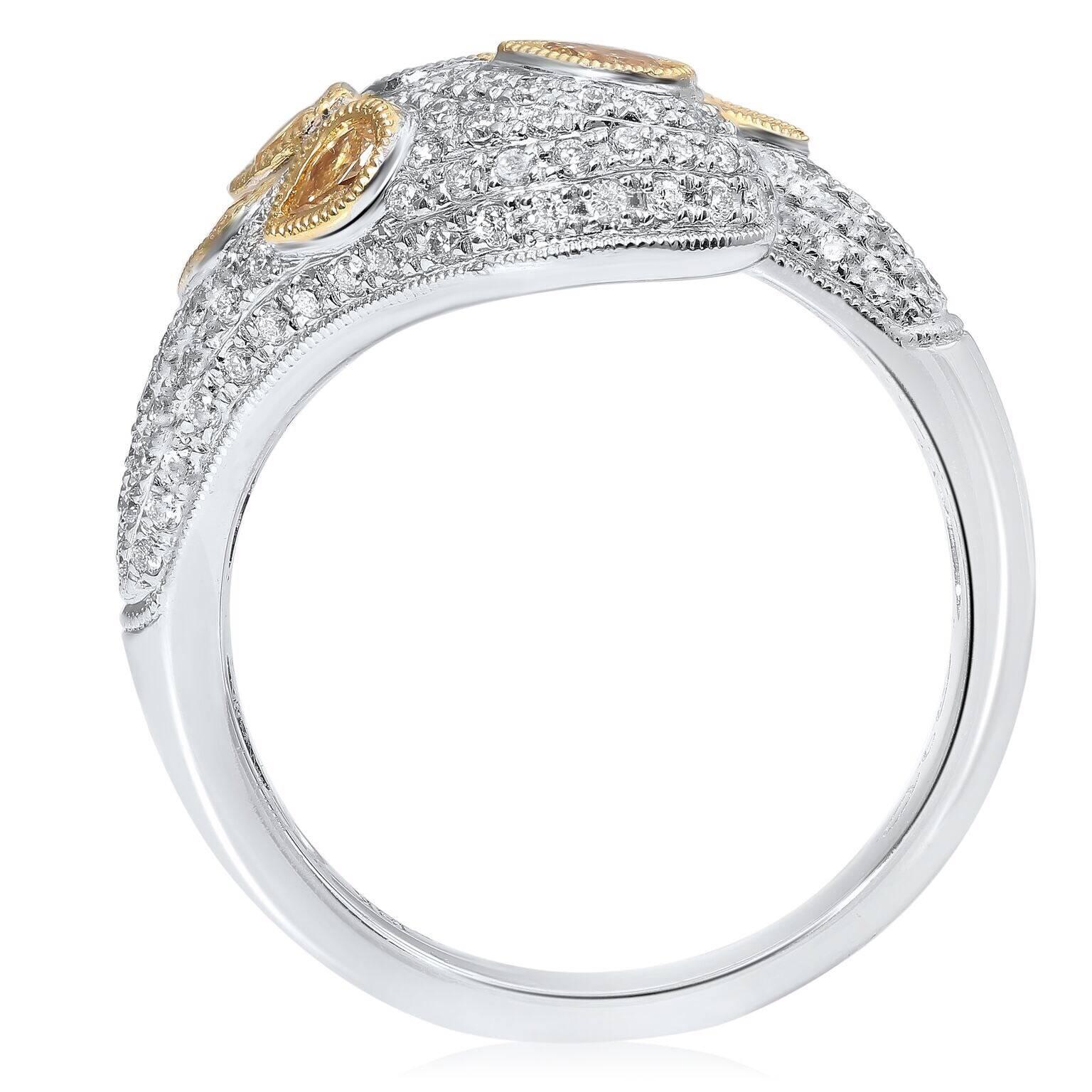 Pear shaped diamonds float on a glistening sea of white diamond pave. The contrast between the rich golden colored diamonds and the scintillating white diamonds evoke opulence. Perfect for casual wear and evening formal ensembles alike. Consider