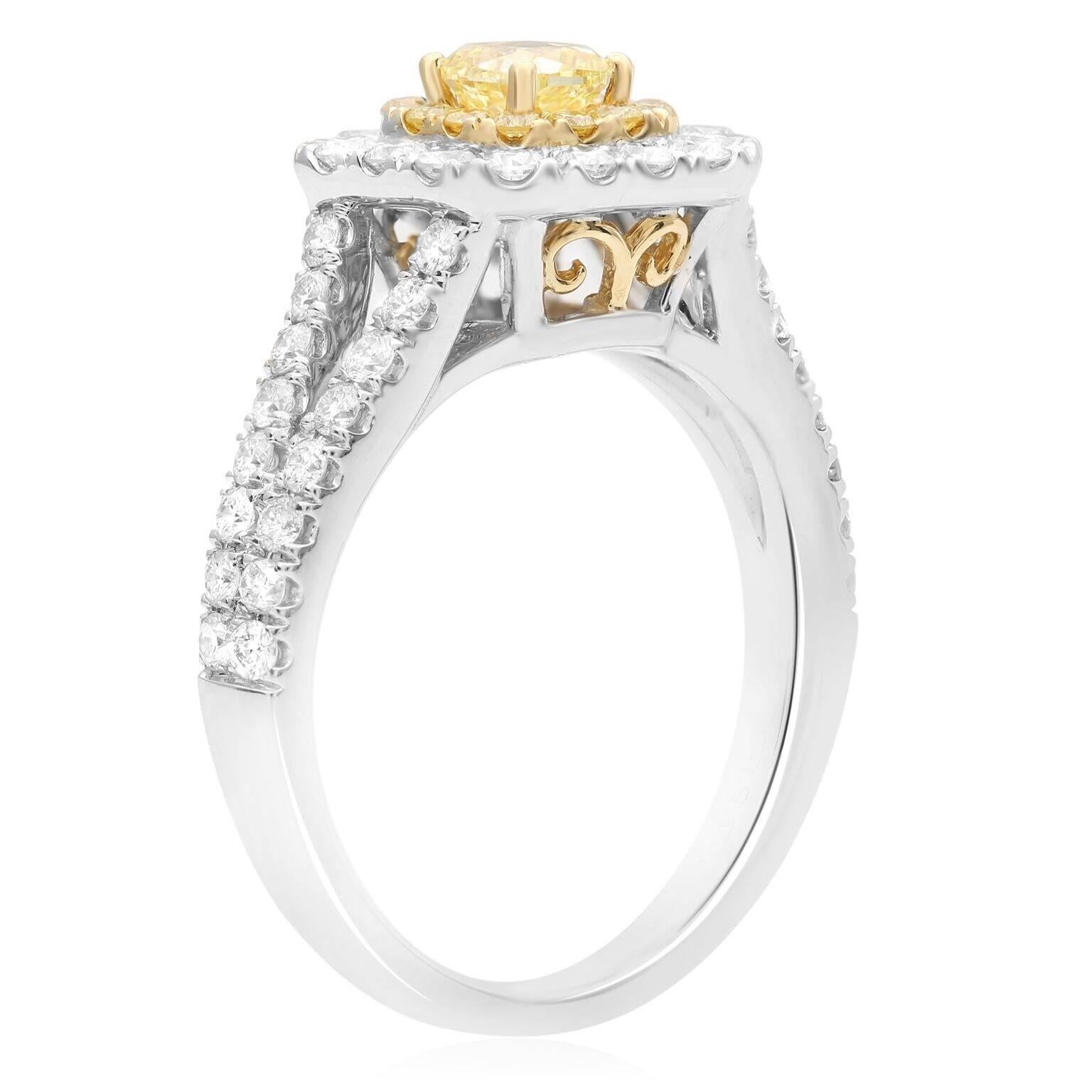 Fancy Yellow Cushion Cut Diamond with a pave halo of fancy yellow diamonds and a second halo of perfectly matched white diamonds. The double halo around the center stone causes it to pop and stand out as a beautiful piece of diamond jewelry.