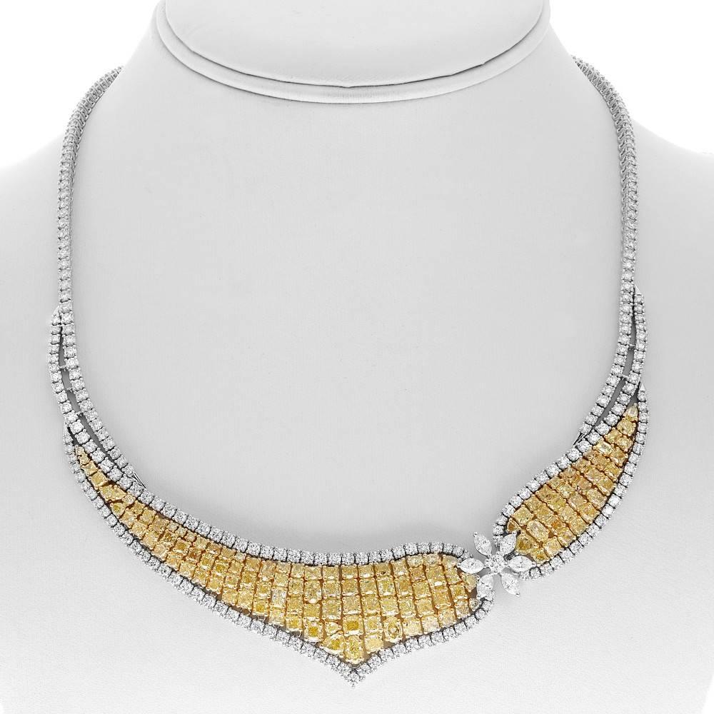 Fancy Yellow and White Diamond style necklace in 18k yellow and 18k white gold. Necklace contains 19.25 carats of Fancy Yellow Diamonds and 12.75 carats of white diamonds. There are 1.13 carats of Marquise cut white diamonds and 11.62 carats of