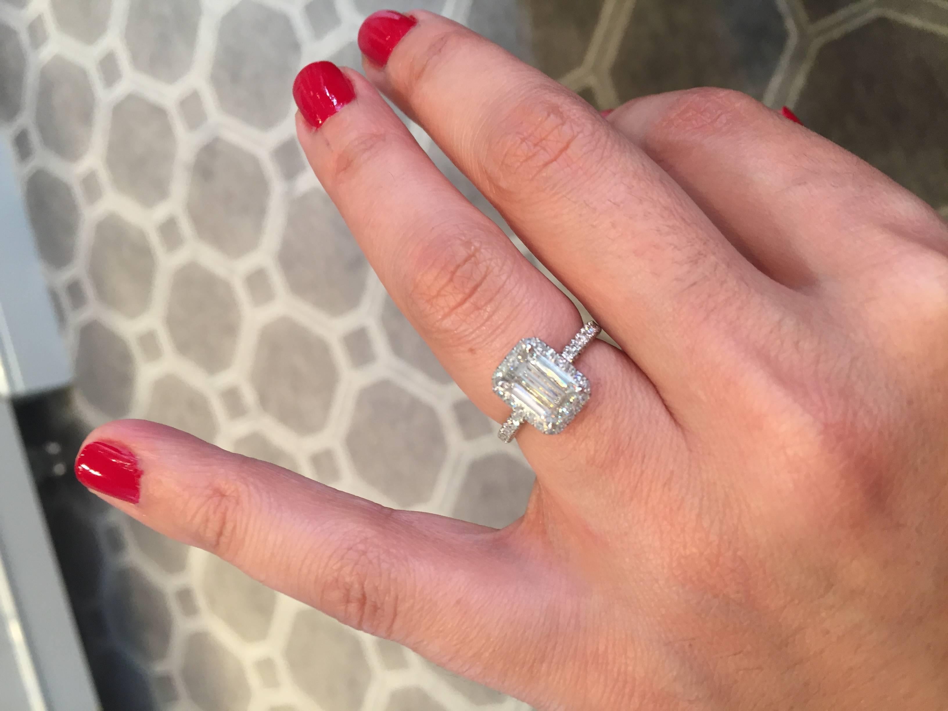 2.01 J color VVS2 clarity Emerald Cut Diamond Engagement Ring

The Marisa Perry InLove setting is handmade with platinum and micro-pave diamonds with an additional 0.45 carats of round brilliant diamonds.  

Each diamond is perfectly hand set under