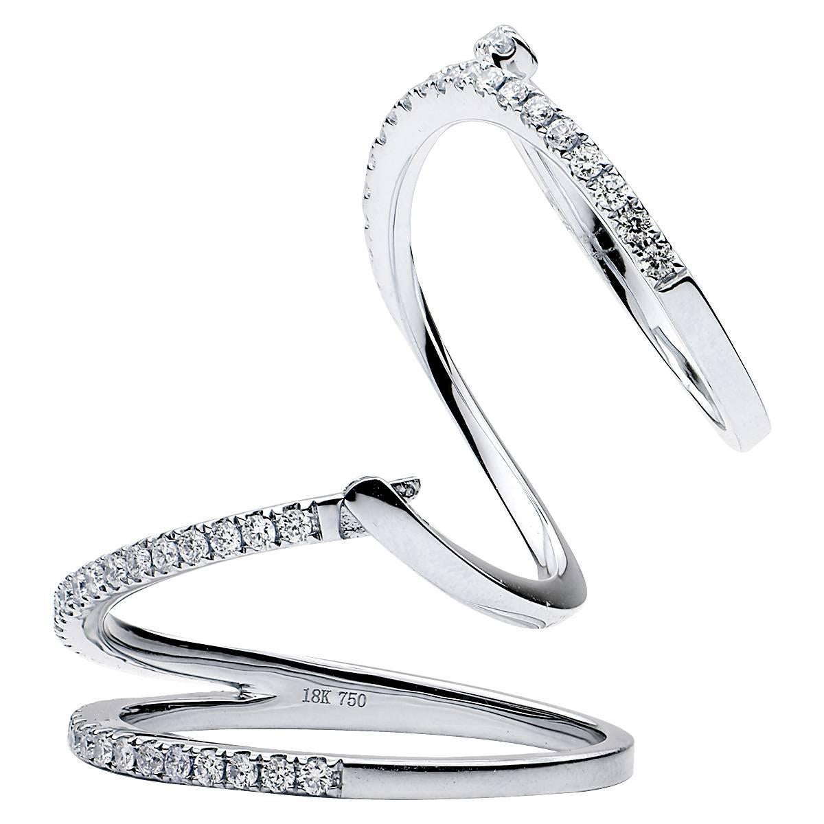 18k white gold with .71 cts. of perfectly matched white diamonds, this ring was created to fit over the knuckle and move with your finger. The ring has a well designed hinge that allows your finger to move and makes the ring appear to move in