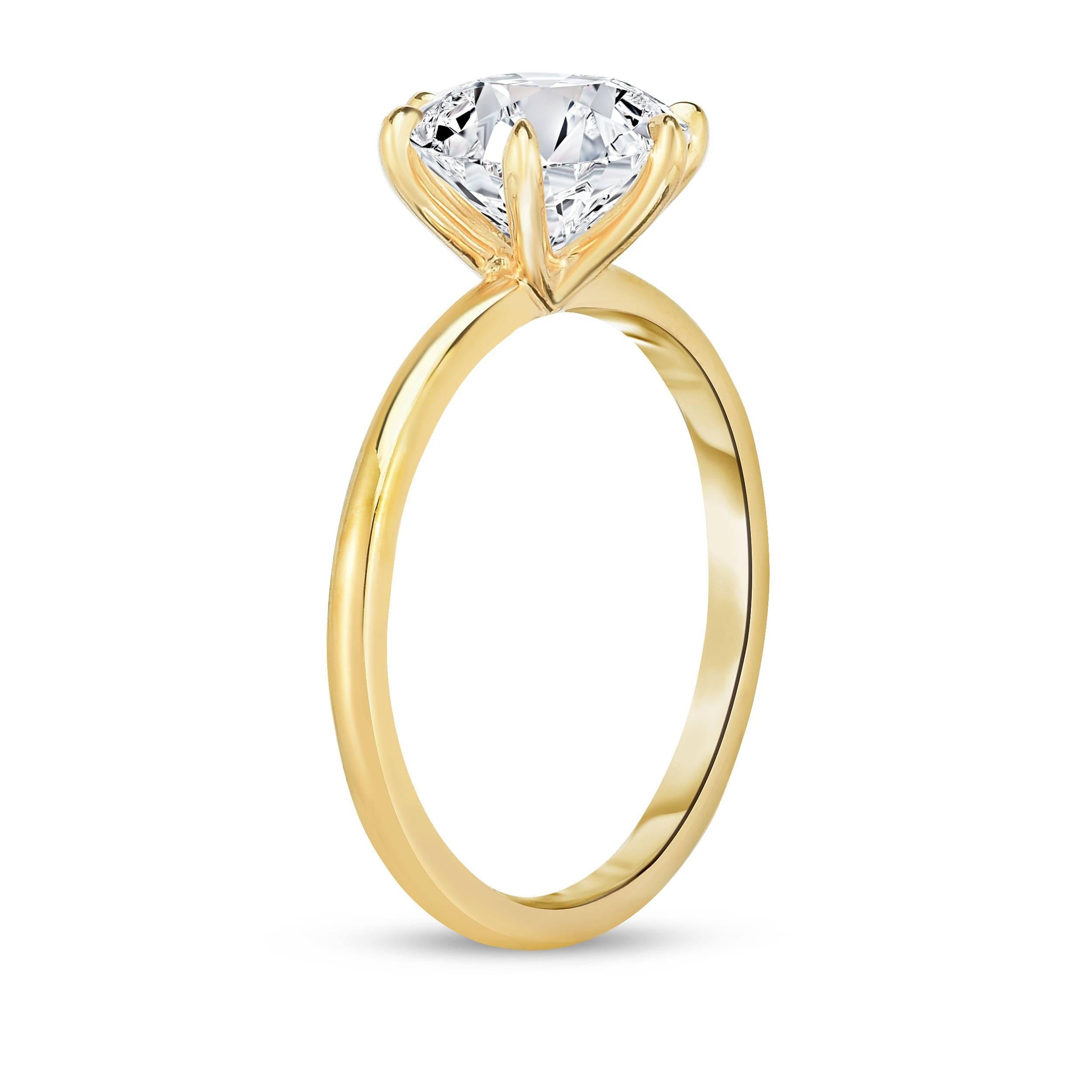 
GIA certified 2.08 carat round solitaire engagement ring. The diamond is exceptionally well cut with an I color and VS2 clarity. Designed and made in New York City, set in 18k yellow gold. 

The six prong ring was designed by Haute Jewelry designer