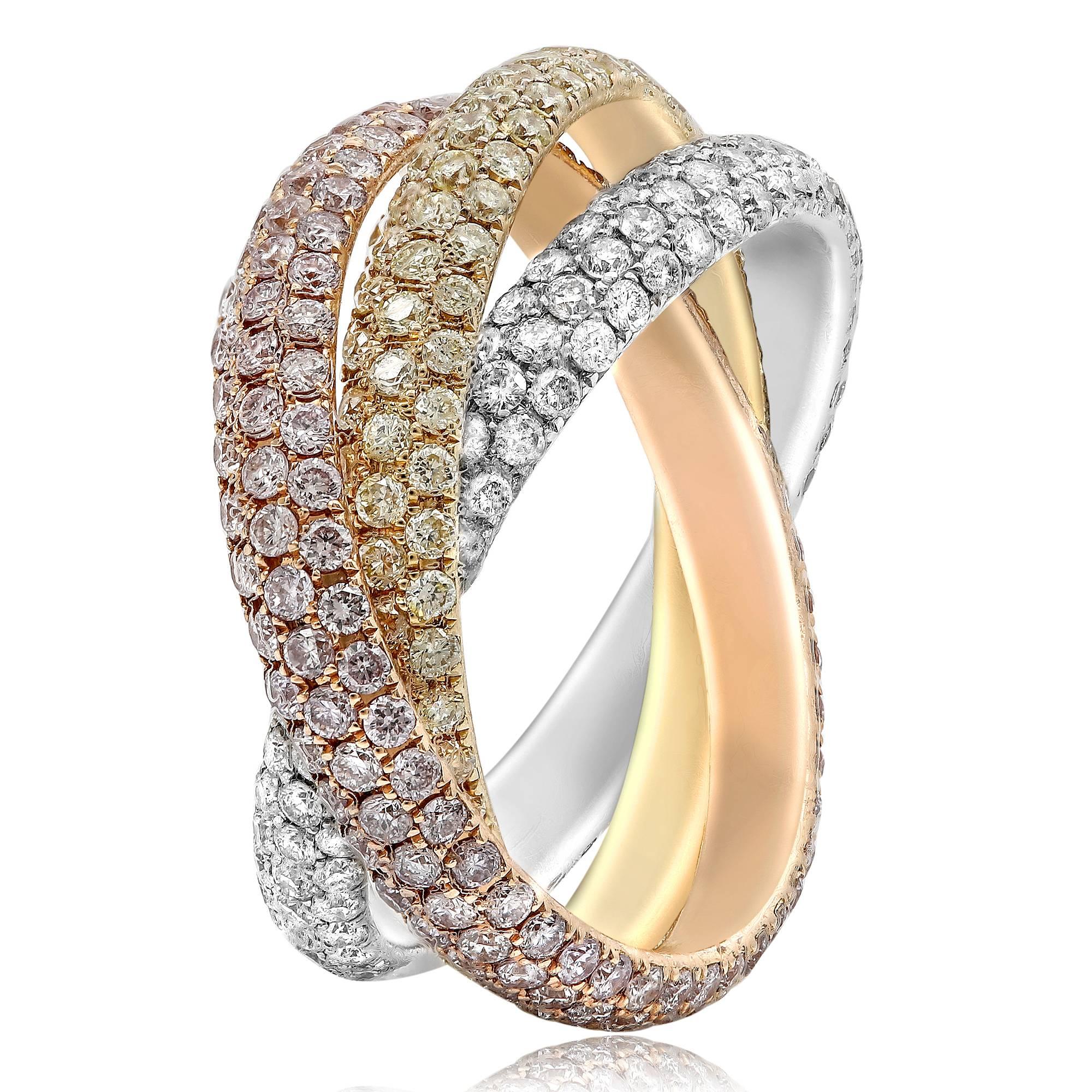 A well coordinated symphony of white, fancy yellow and fancy pink diamonds. Interlocking micro pave diamond ring in pink diamonds, yellow diamonds and white diamonds. Set in 18k white gold, 18k rose gold and 18k yellow gold. Total carat wight is