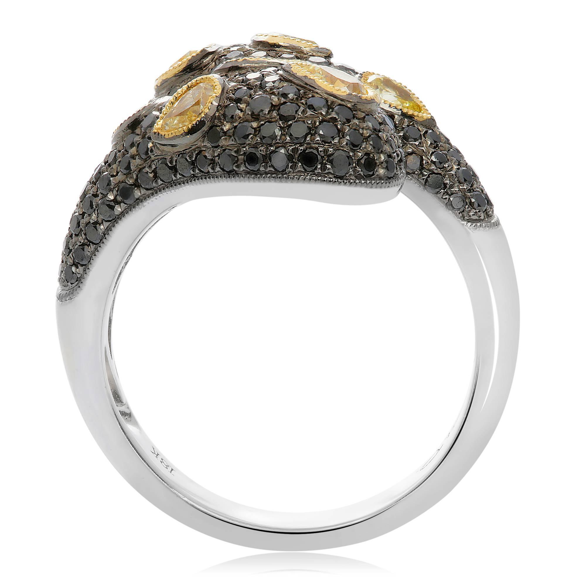 Pear shaped diamonds float on a luscious sea of black pave diamonds. The contrast between the rich golden diamonds and the glistening black diamonds evoke luxury. Perfect for casual wear and evening formal ensembles alike. Consider this ring for