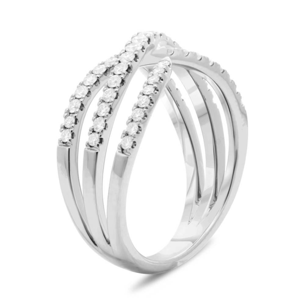 Contemporary style thin style overlapping ring in 14k White Gold with Diamonds. Perfect as a fashion piece or added to a bridal jewelry ensemble. Elegant yet edgy this ring would make a perfect birthday gift or push present. This ring contains 0.45