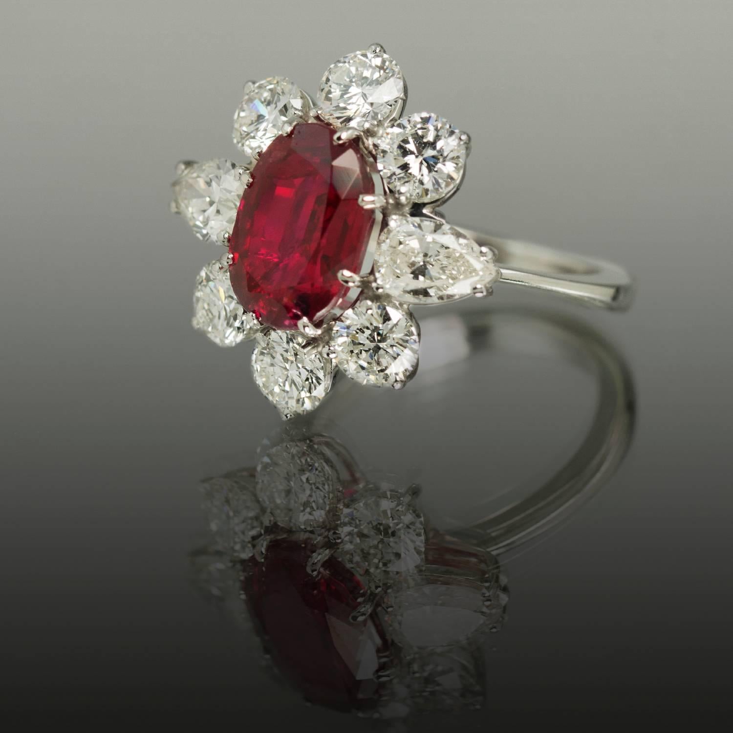 Platinum Ring with 5.19 Carat Gubelin certified No Heat Burma Ruby and 2 pear shape diamonds weighing 1.15 carat and 6 round brilliant diamonds weighing 2.77 carats. Ring is size 6 1/2, but can be sized.

Note: The stone certified by Gubelin in a