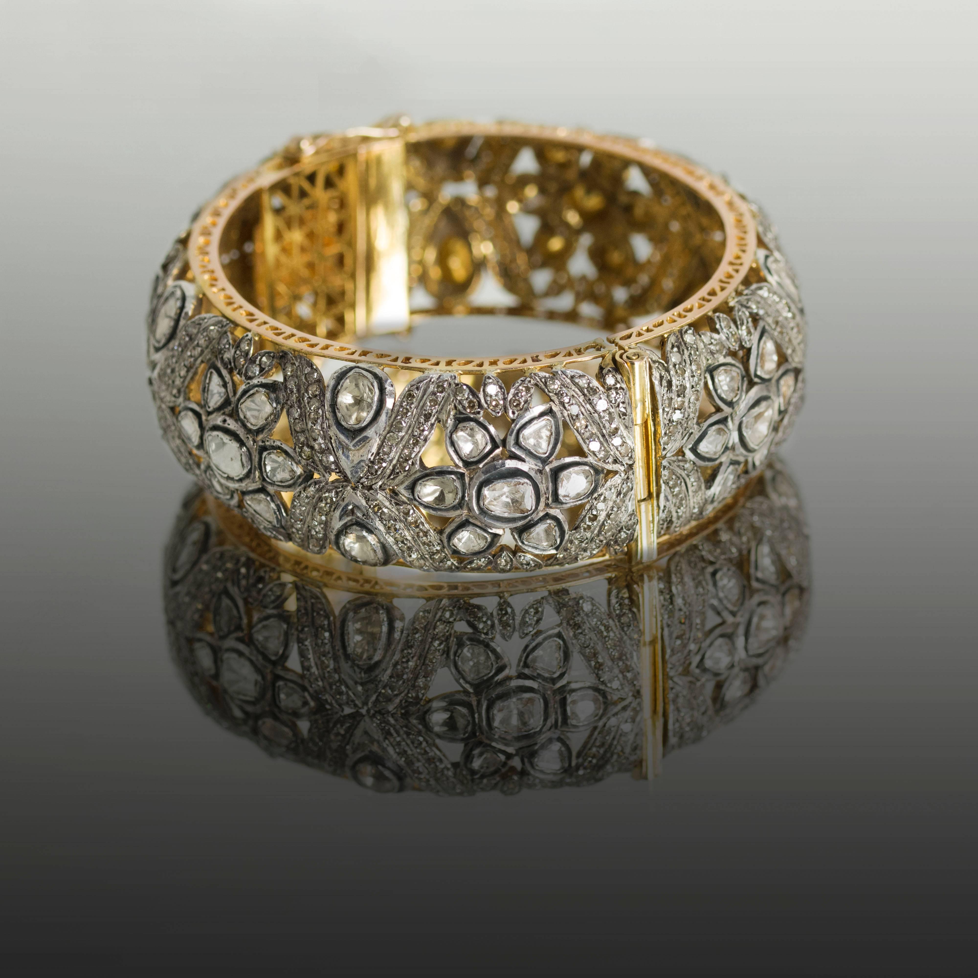 18k & Silver overlay bangle bracelet with approximately 15 carats of rose cut and round diamonds. This piece is made in India