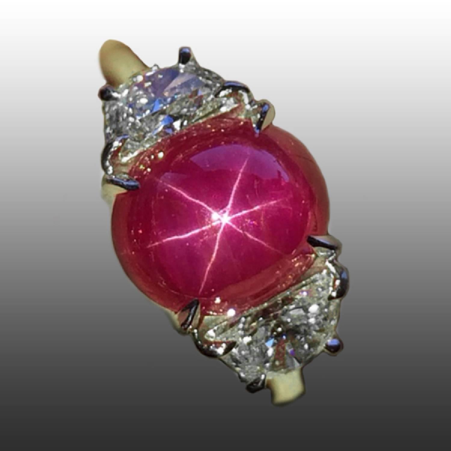 Platinum Ring with AGL certified 6.19 carat Burmese Star Ruby and two trapezoid diamonds weighing approximately 1.10 carats.