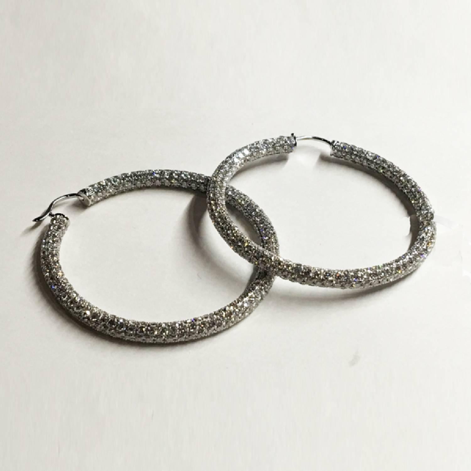 18k White Gold Hoop Style Earrings with 14.38 carats of pave set F-G color VS+ clarity round brilliant diamonds,
