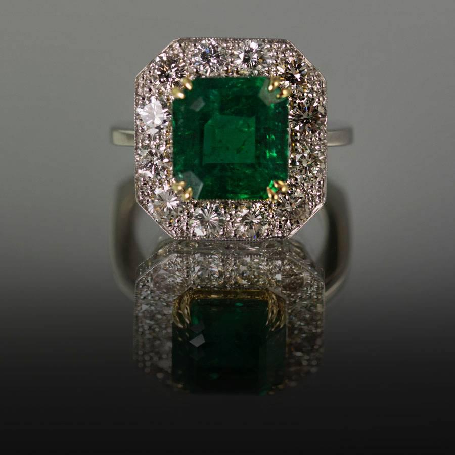 Hand Fabricated Platinum Ring by Keith Davis for Thayer Jewelers. Containing one very fine emerald cut Zambian Emerald weighing 5.29 carats and 12 modern round brilliant diamonds weighing 1.68 carats.   

Keith Davis 
Before coming to the United