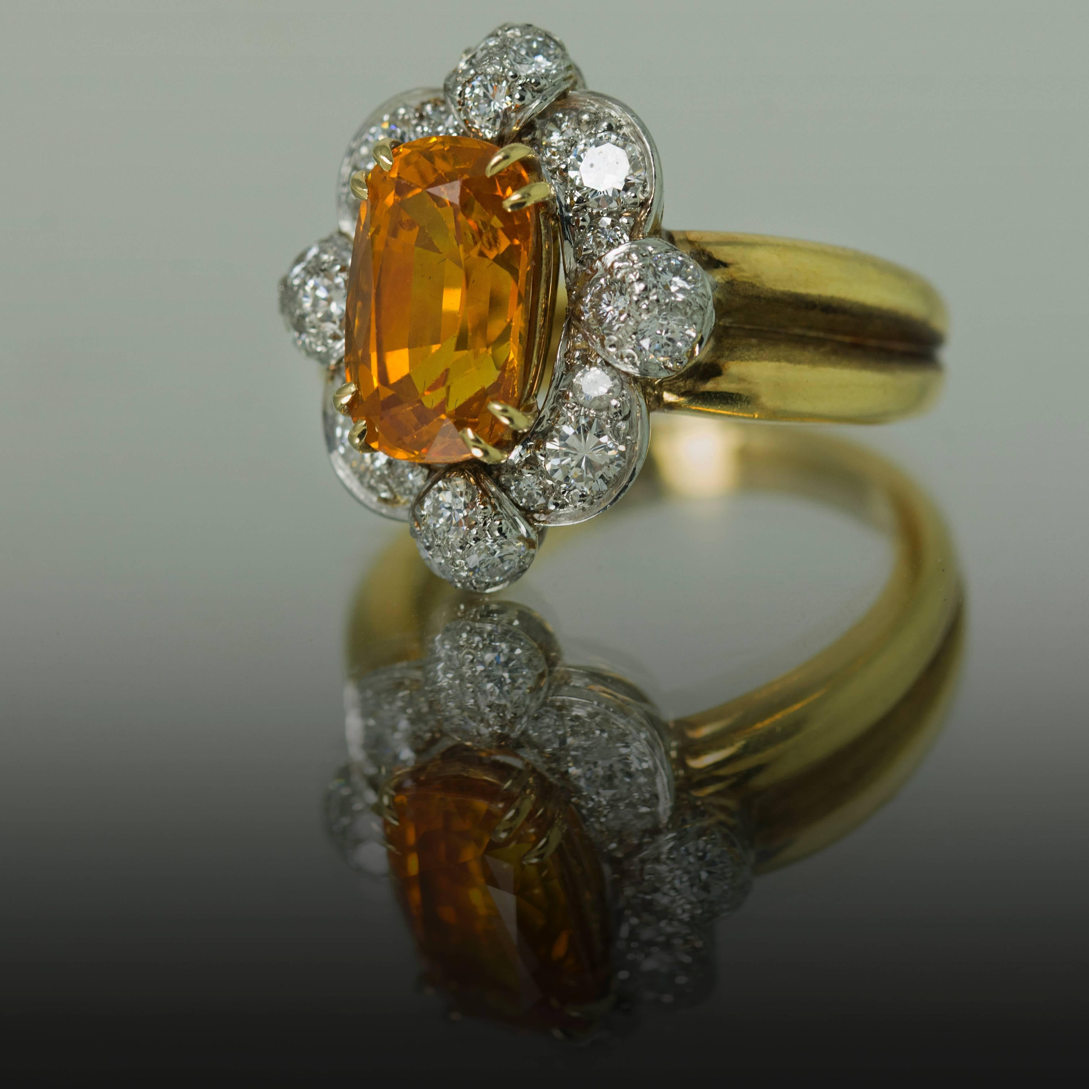 Hand Fabricated 18k Ring by Keith Davis for Thayer Jewelers. Containing one natural orange sapphire weighing 3.98 carats and round brilliant diamonds weighing 0.88 carats.  Free Ring Sizing

Keith Davis 
Before coming to the United States to do