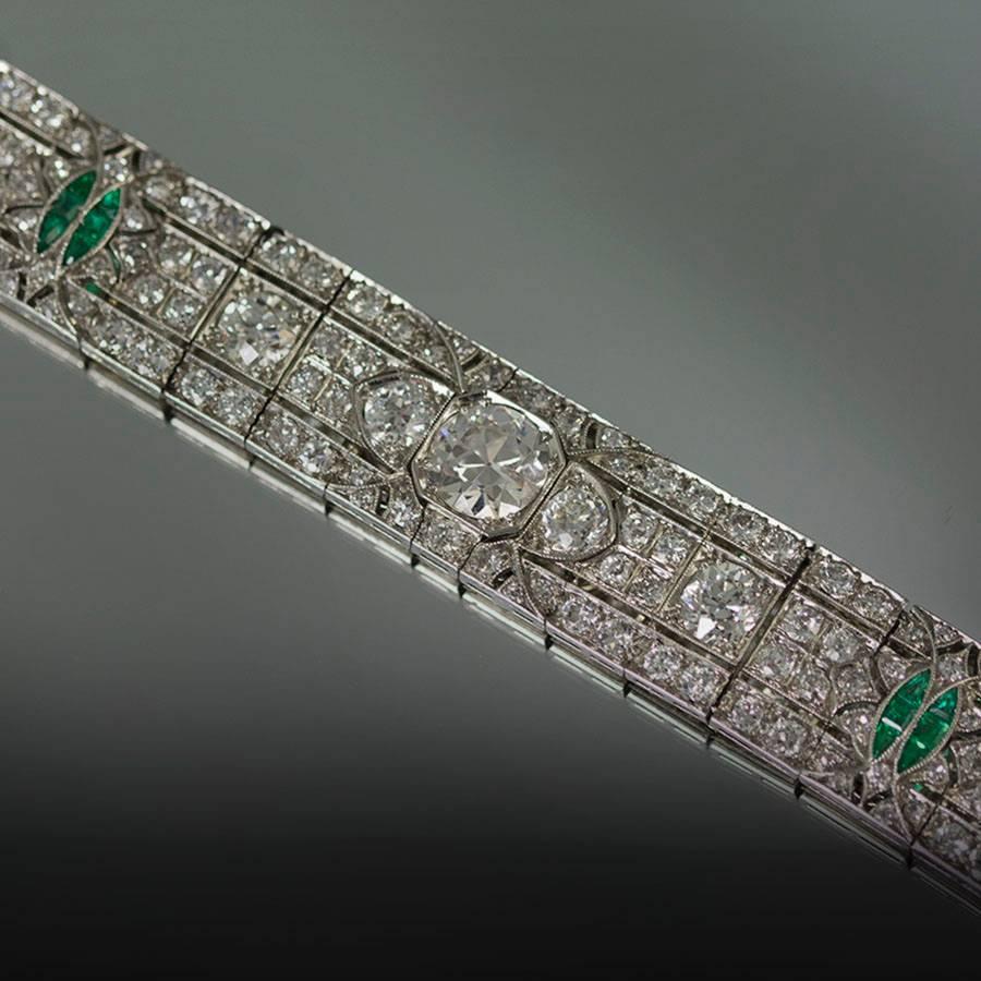 Beautiful Platinum Art Deco Bracelet Circa 1930 Old Euro Diamonds Weighing 20.00 Carats and Emeralds Weighing Approximately 1.00 Carat.   