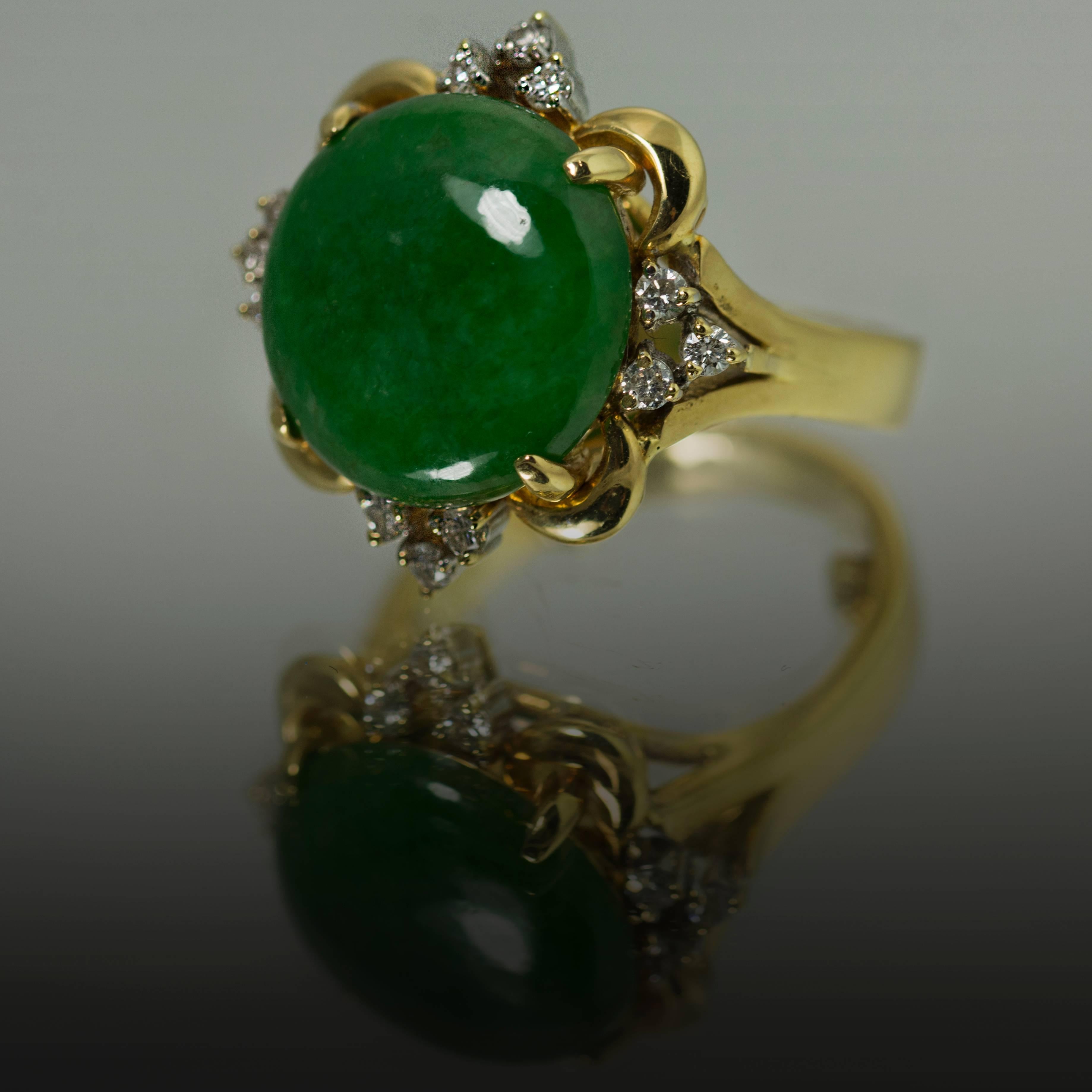 18k Ring with one Jade cabochon weighing approximately 8.00 carats and approximately 0.18 carats of diamonds