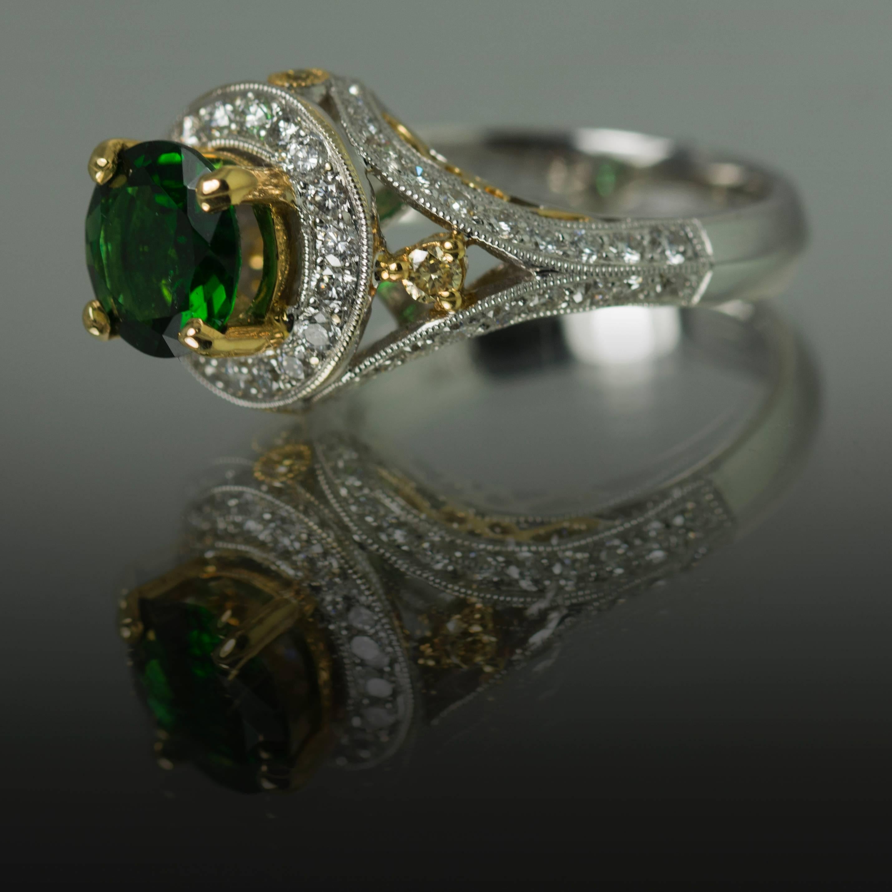 18K Ring with 1 Oval Chrome Tourmaline Weighing 1.40 Carats, Yellow Diamonds Weighing 0.11 Carats, and White Diamonds Weighing 0.73 Carats. 