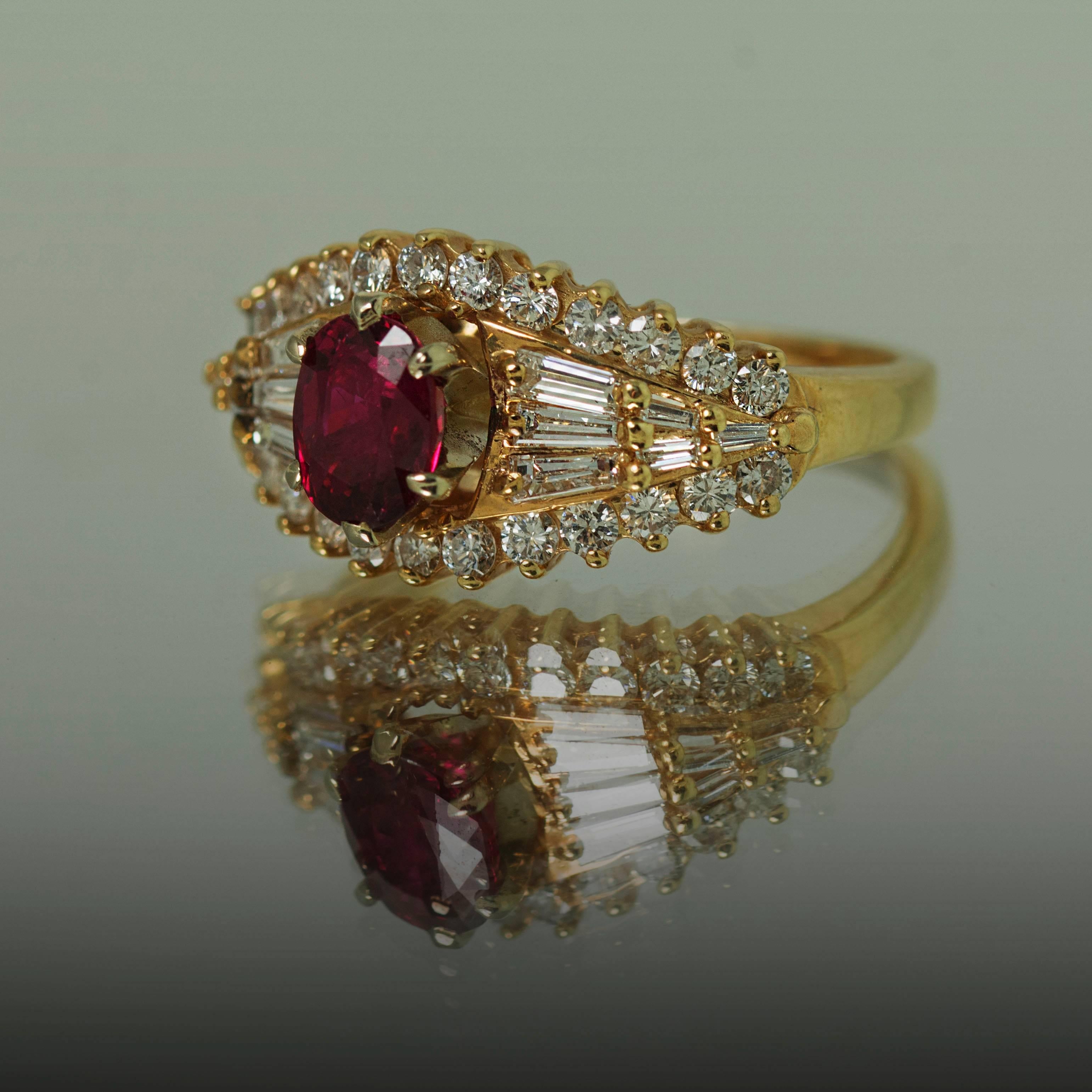 14K Yellow Gold Ring with 1 Oval Burma Ruby Weighing 1.07 Carats and 26 Round Diamonds Weighing 0.78 Carats and 12 baguette Diamonds Weighing 0.46 Carats.