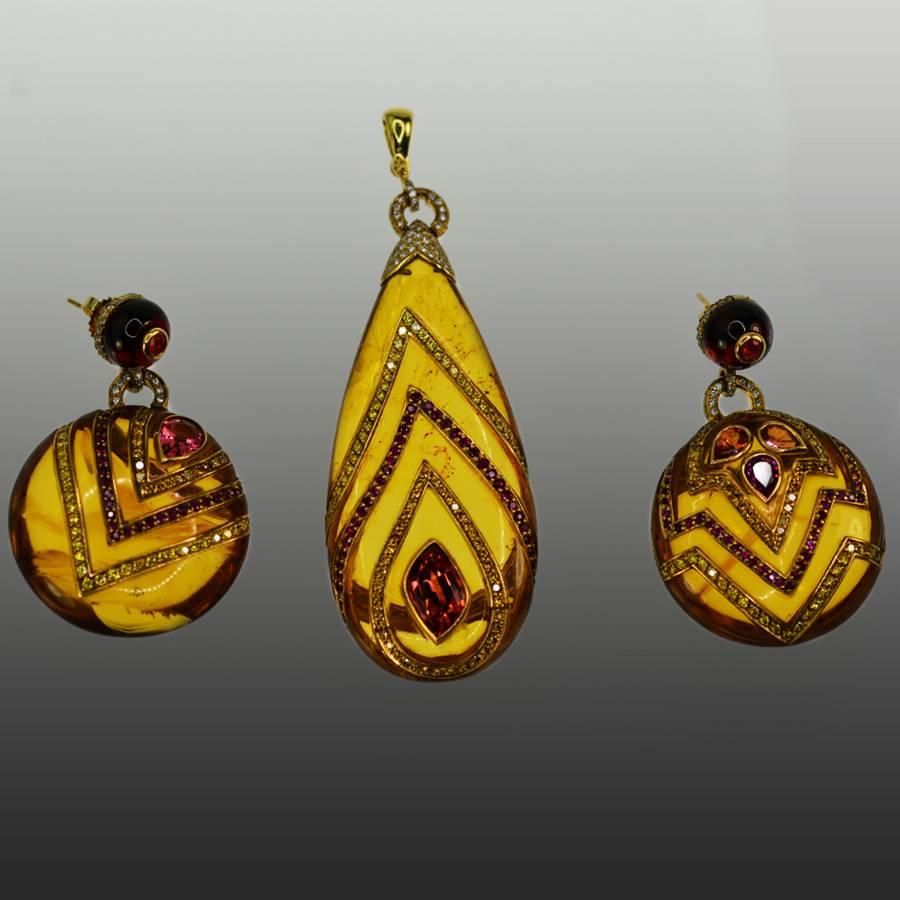 Exotic Amber earring and pendant suite with natural intense fancy yellow diamonds, Burma rubies and Burma spinels. Earrings are 2