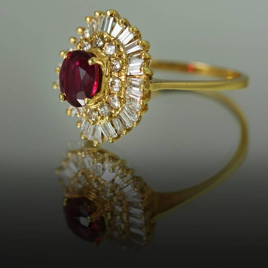 Beautiful 1960's "Ballerina" ring with vivid red natural ruby weighing 1.09 carats and approximately 1.15 carats of round brilliant and tapered baguette diamonds.