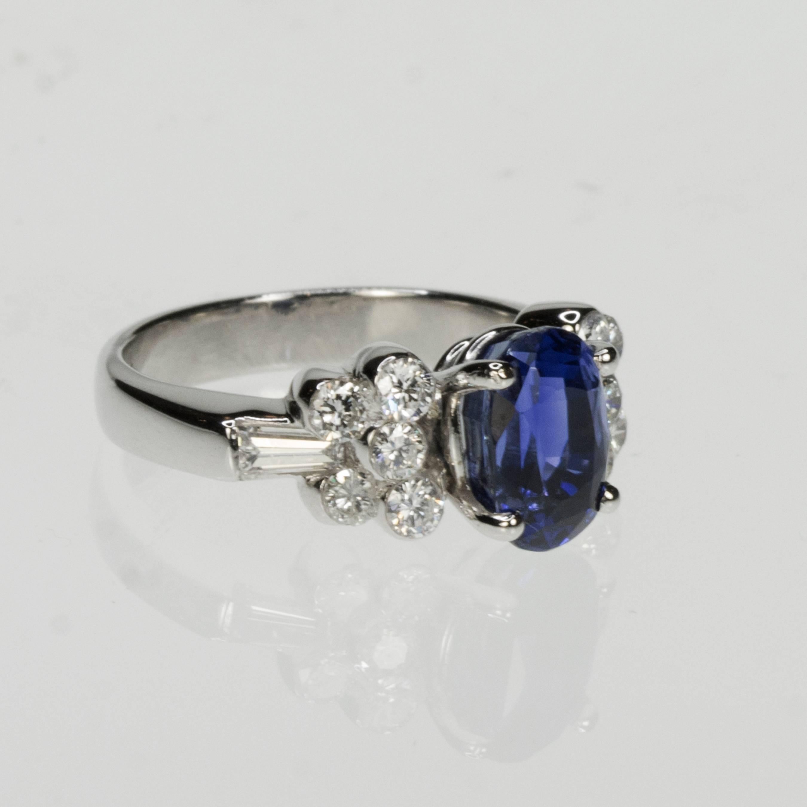 18k Ring with 1 AGL certified Ceylon Sapphire weighing 3.47 carats and round brilliant and staight baguette diamonds weighing 0.85 carats.