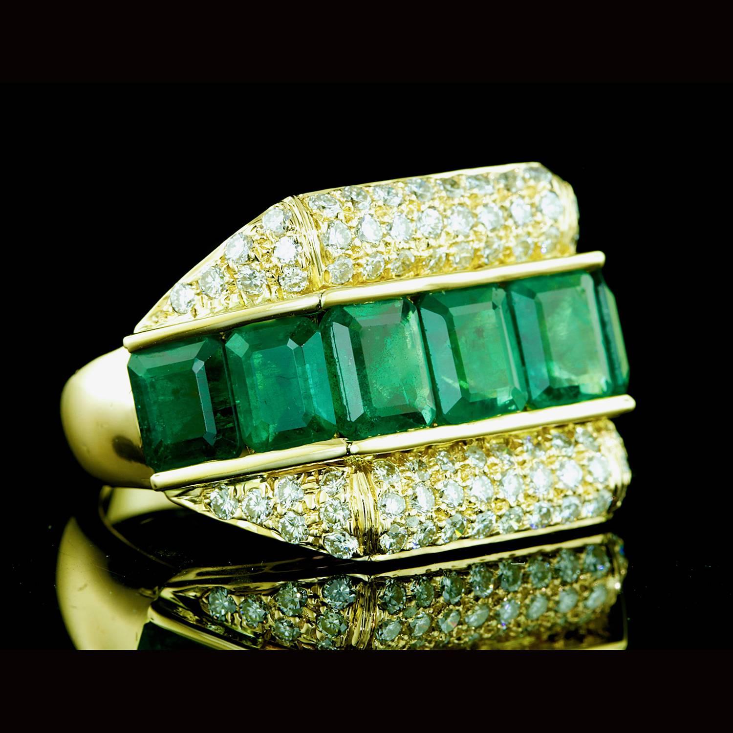 18k Ring with 7 emerald cut emeralds weighing approximately 7.00 carats and 76 round brilliant diamonds weighing approximately 1.50 carats. 11.82g
