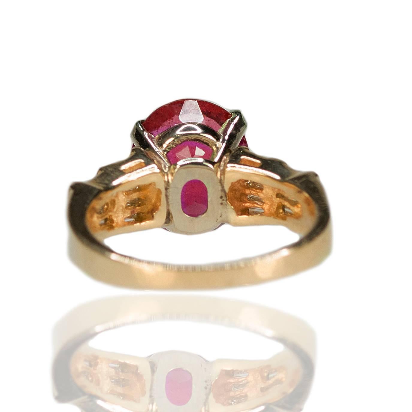 14k Ring set with one 5.13 carat Rubellite Tourmaline and approximately 0.50 carats of tapered baguette diamonds, 6.42g
