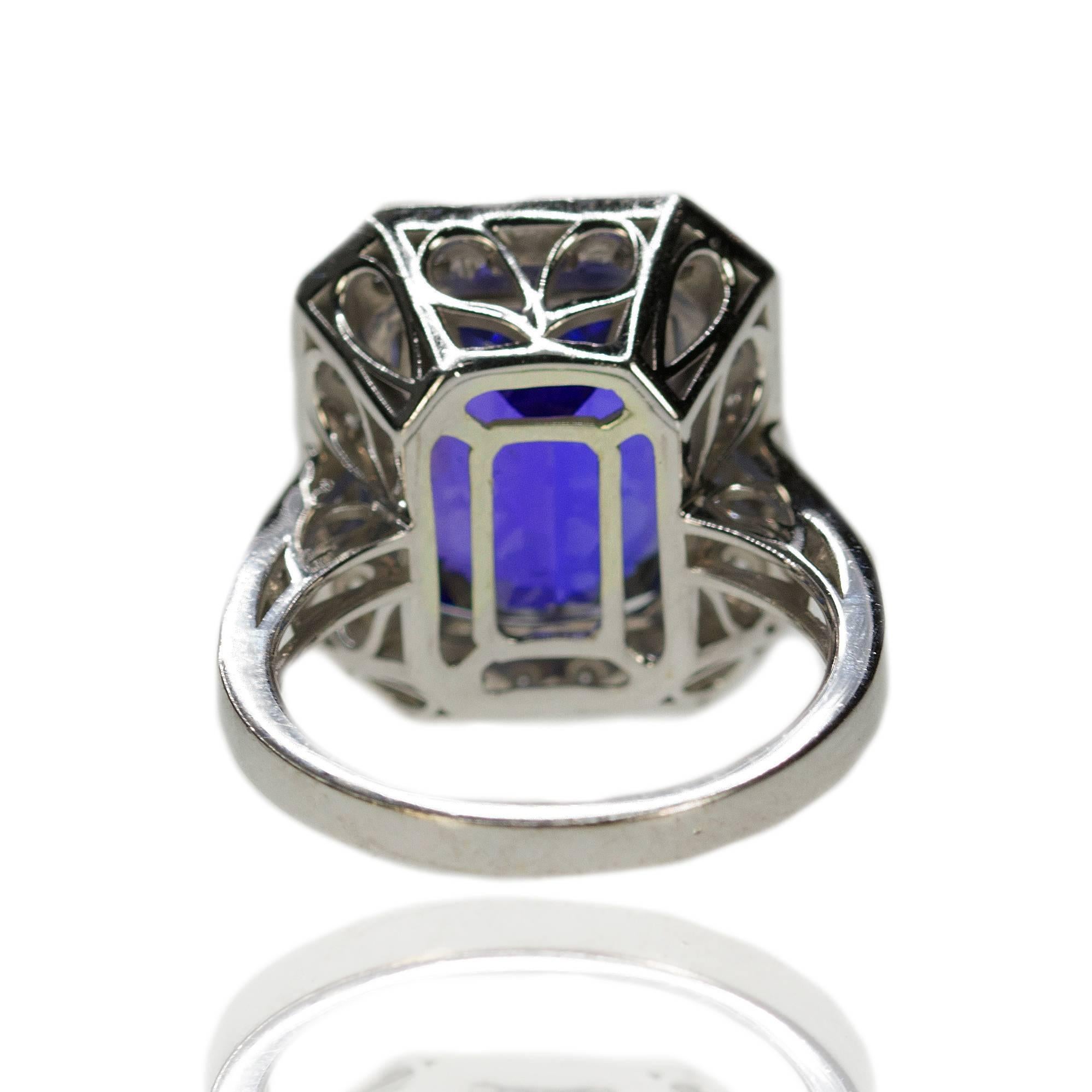 18k Ring with 9.51 carat cushion cut Tanzanite and approximately 1.00 carats of round brilliant and baguette cut diamonds. 8.91g