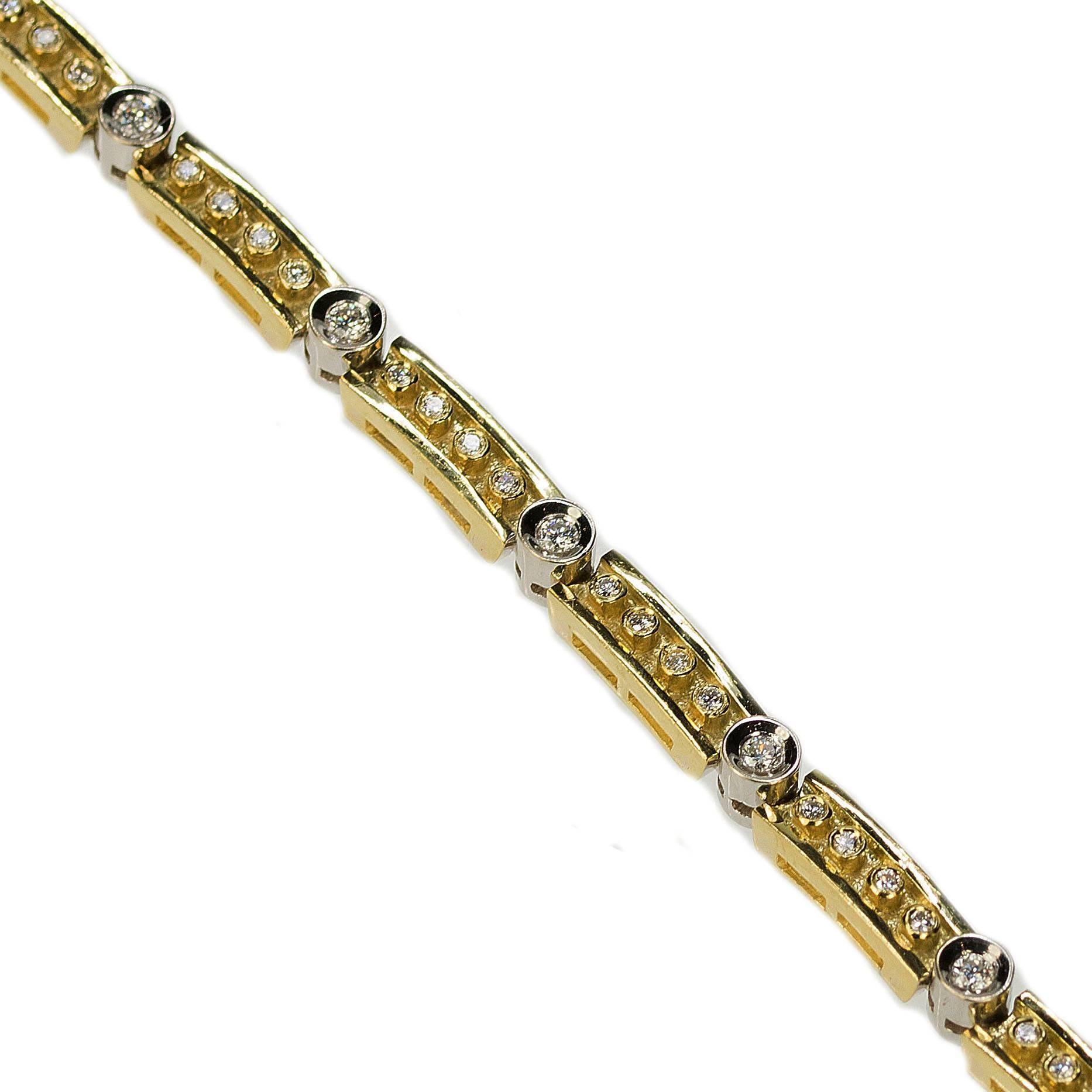 18k Yellow & White Gold Bracelet with 45 modern round brilliant diamonds weighing aproximately 1.60 carats. 31.97g
