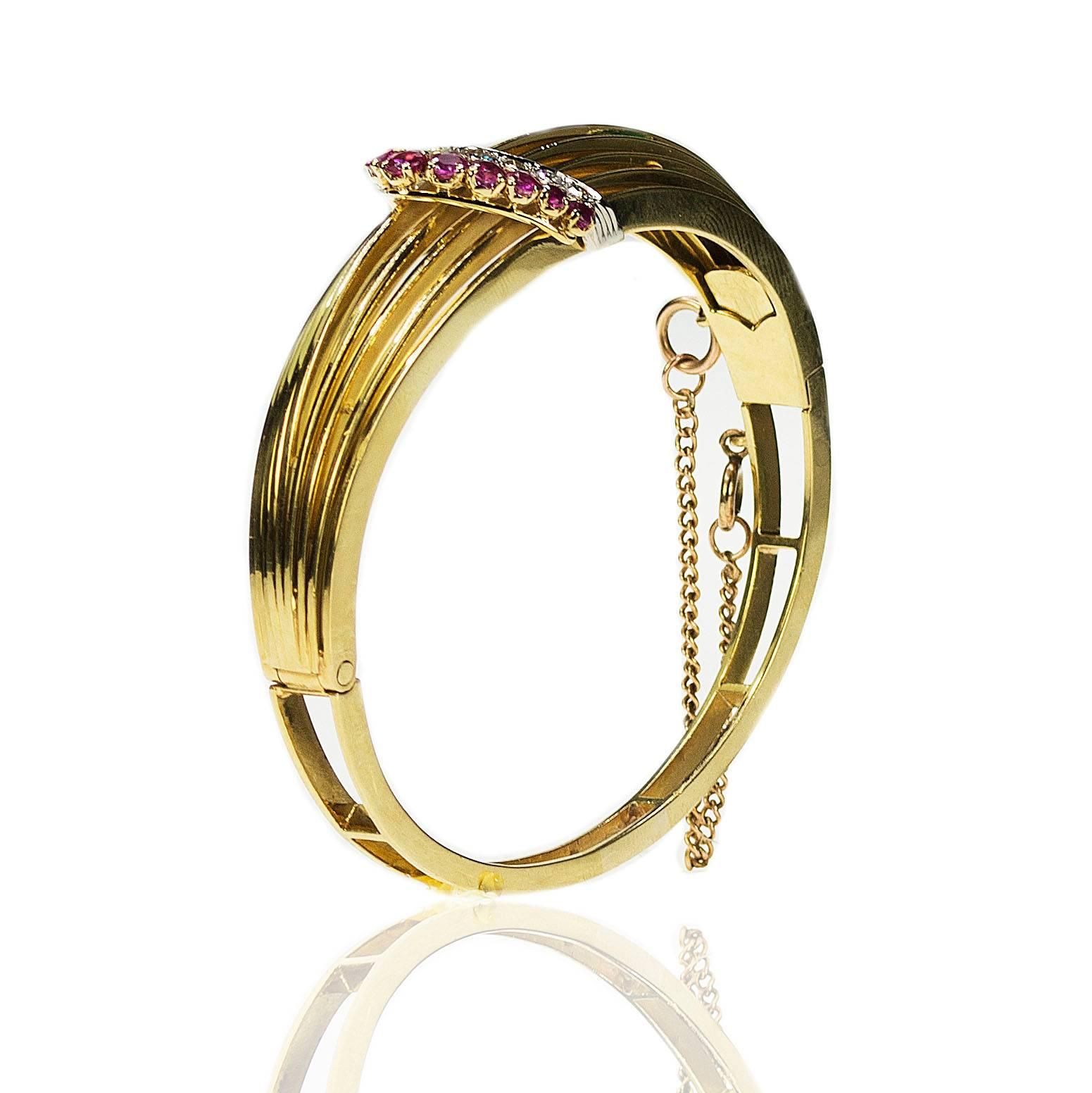 18k Retro Style Bangle containing 11 Burma Rubies weighing approximately 1..25 carats and 9 round diamonds weighing 1.15 carats. 38.82g