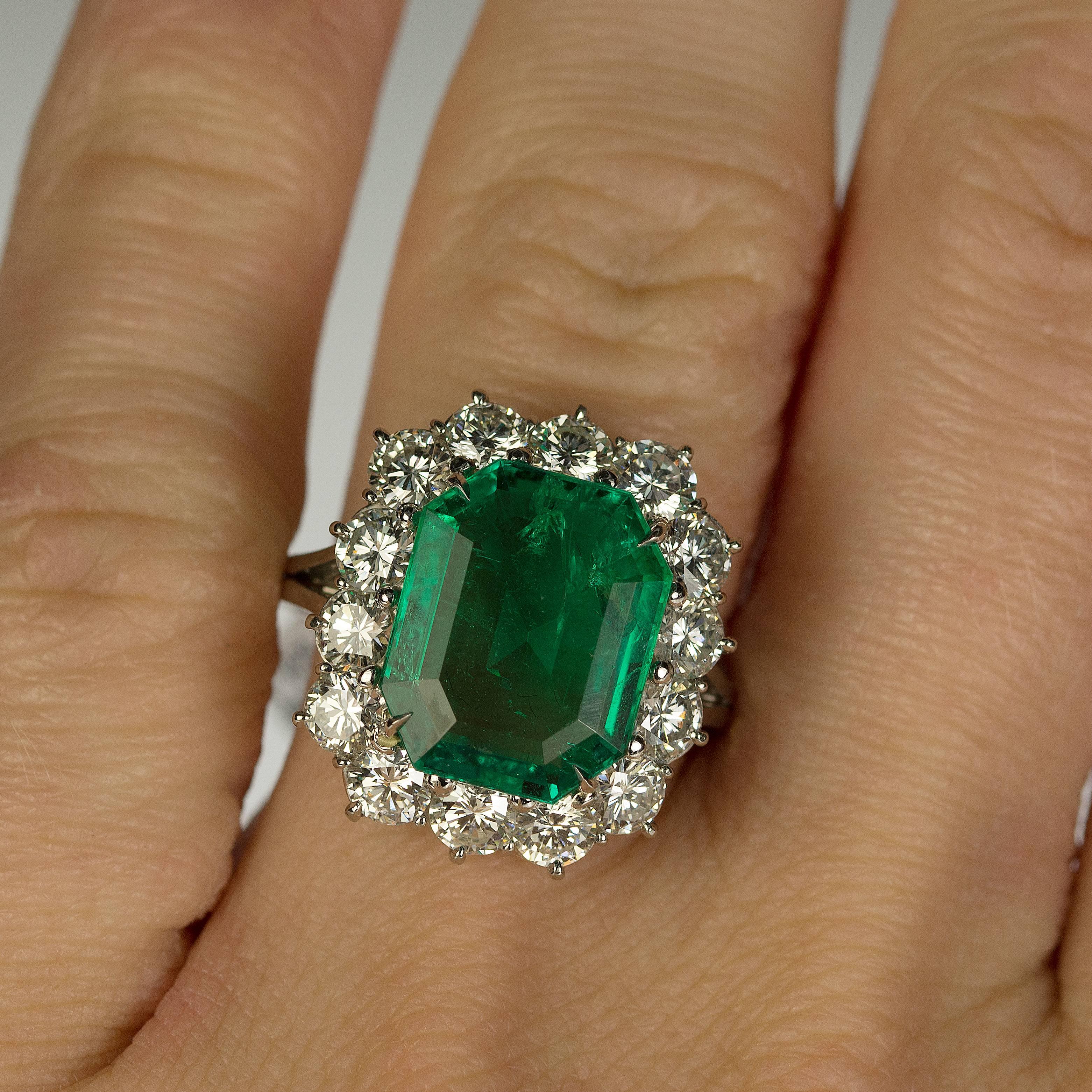 AGL Certified 6.01 carat "No Oil" Colombian emerald set in platinum with approximately 2.50 carats of colorless round brilliant diamonds.