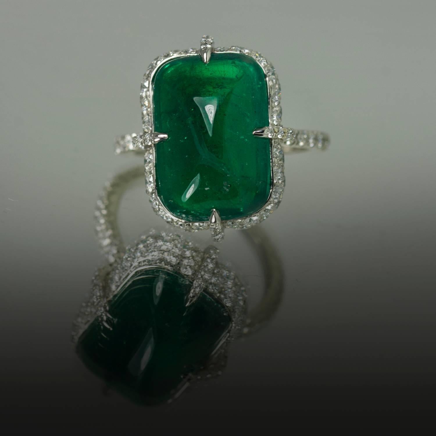 Hand fabricated platinum ring with gem quality 9.88 carat Gubelin certified cabochon cut Colombian emerald with only minor enhancement. In addition there are 2.98 carats of collection color clarity pave set diamonds. 